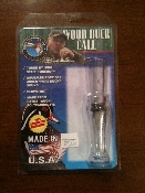 A duck call is packaged in its package.
