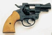 A black gun with wooden handle on white background.