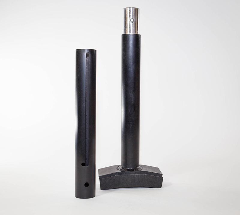 A pair of black poles with one pole bent to the side.